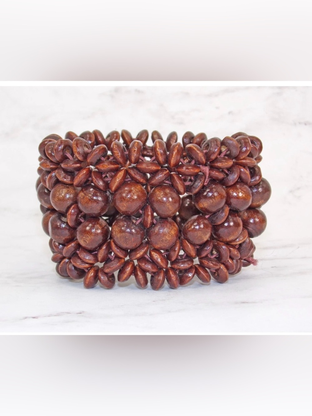 Brown wide wood stretch bracelet with a mix of round and disk shape wood beads